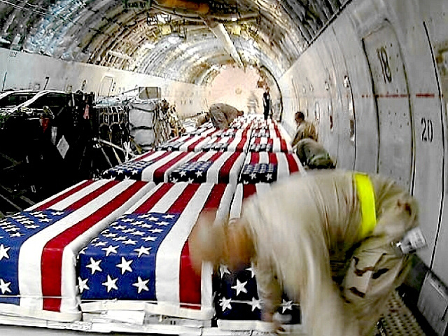flag-draped coffins of dead US military on aircraft