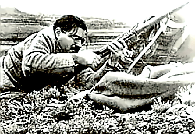 Hemingway in Spain with rifle