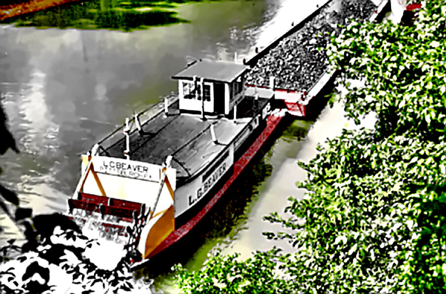 Mississippi Steamboat pushing a coal barge