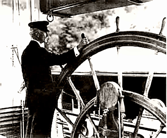 Mississippi Steamboat Pilot at the wheel