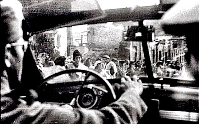 The Warsaw Ghetto street scene from a Nazi vehicle